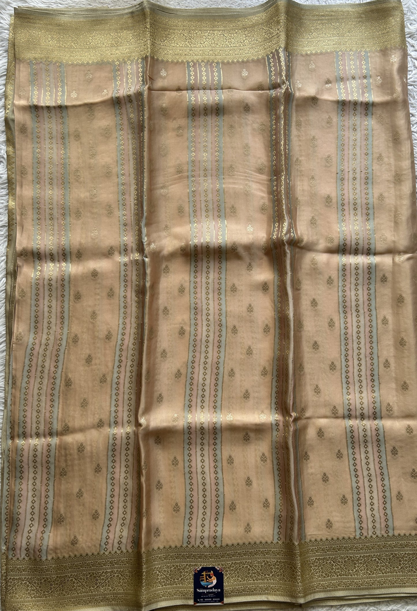 Pure Banarasi Crepe Silk Saree Light Peach Colored Complemented with a Zari border. - Sampradaya Designer Studio