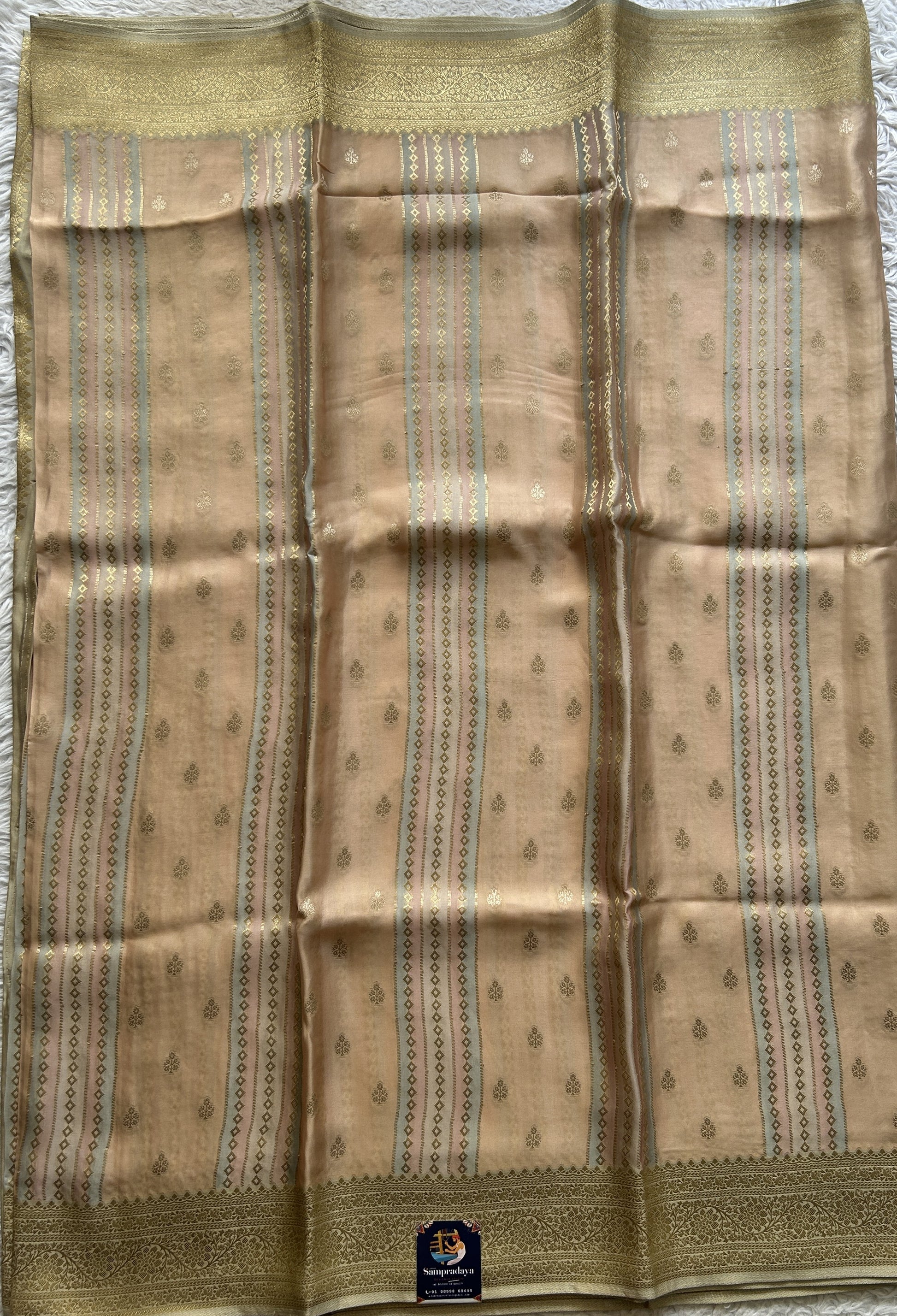 Pure Banarasi Crepe Silk Saree Light Peach Colored Complemented with a Zari border. - Sampradaya Designer Studio