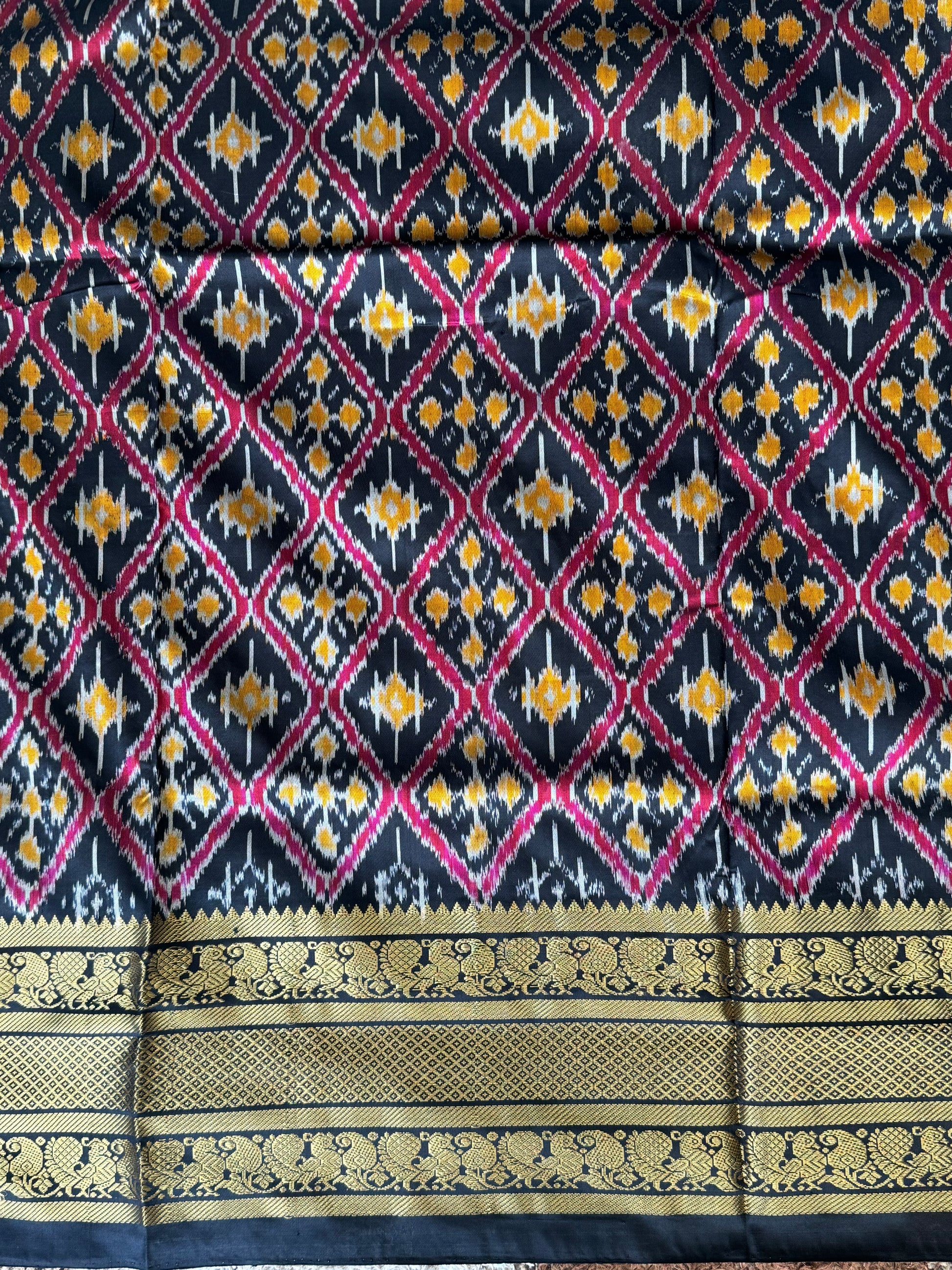 Ikkat Pattu Saree Off White colored complemented with a Kanchi border. - Sampradaya Designer Studio