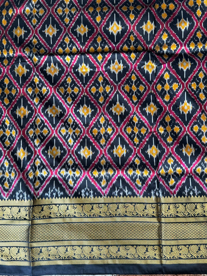 Ikkat Pattu Saree Off White colored complemented with a Kanchi border. - Sampradaya Designer Studio
