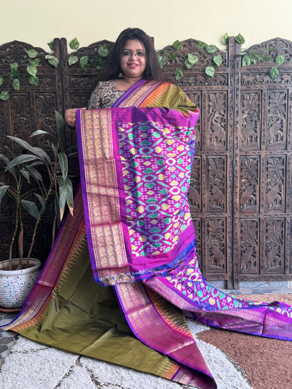 Ikkat Pattu Saree Olive Green colored complemented with a Kanchi border. - Sampradaya Designer Studio