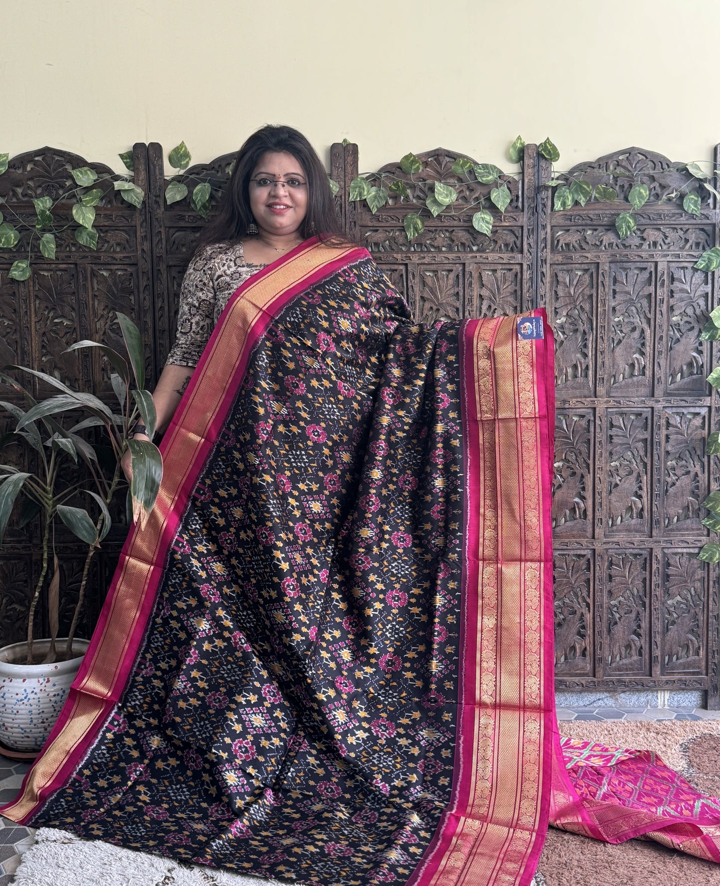 Ikkat Pattu Saree Black colored complemented with a Kanchi border. - Sampradaya Designer Studio