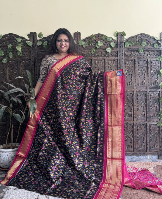 Ikkat Pattu Saree Black colored complemented with a Kanchi border. - Sampradaya Designer Studio