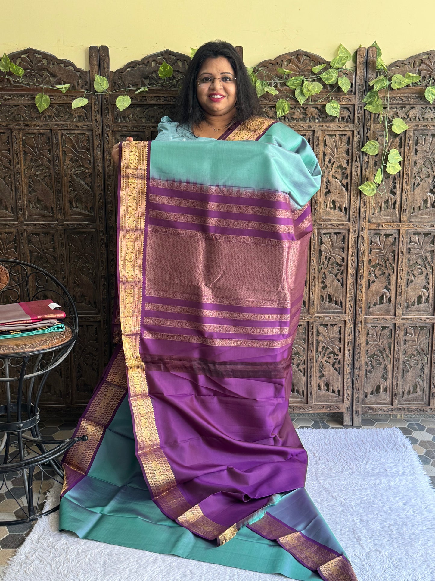 Pure Kanjivaram Silk Saree Gray Colored Elegantly Paid with a Gold Zari Border.