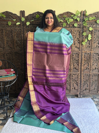Pure Kanjivaram Silk Saree Gray Colored Elegantly Paid with a Gold Zari Border.