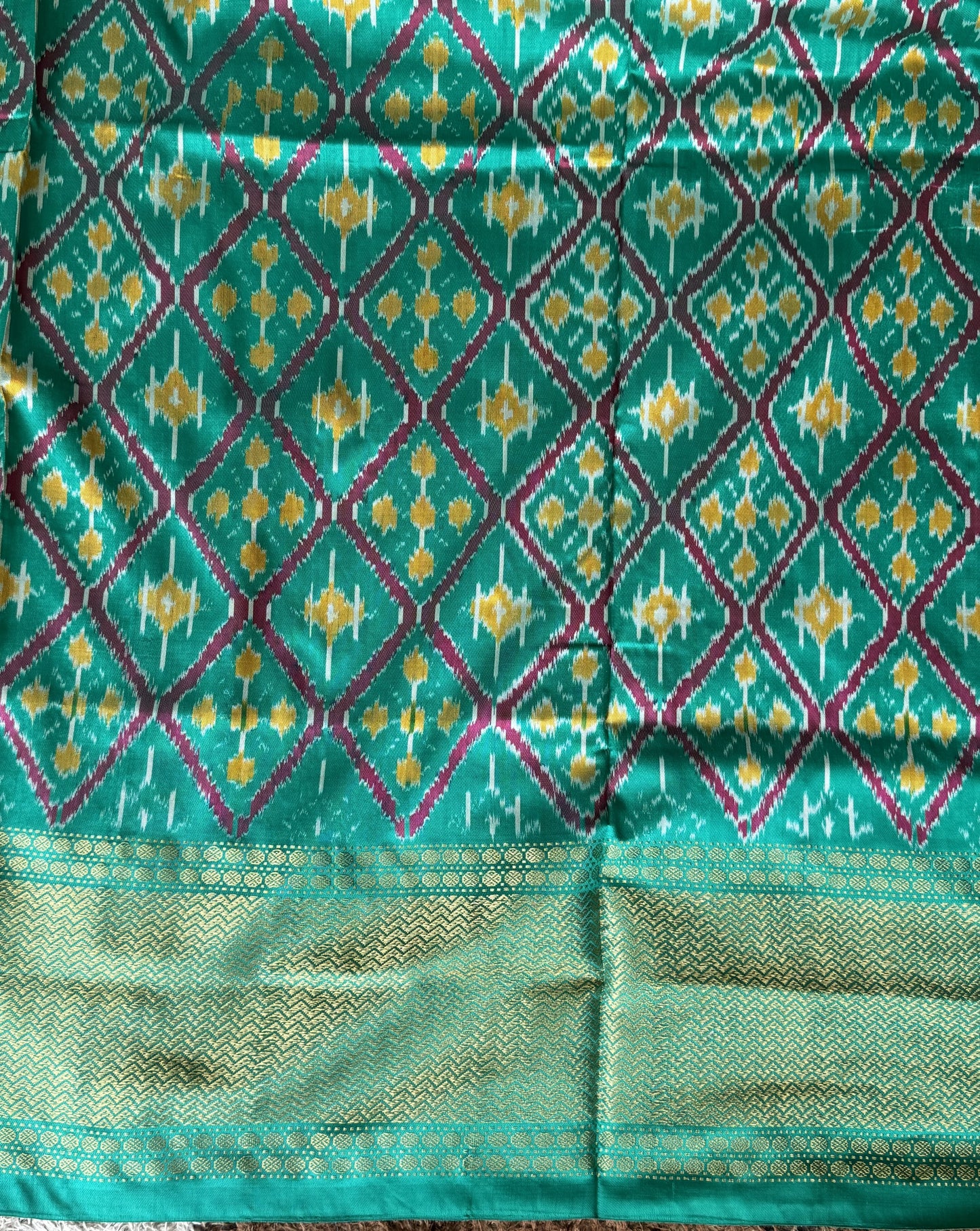 Ikkat Pattu Saree Dark Pink colored complemented with a Kanchi border. - Sampradaya Designer Studio