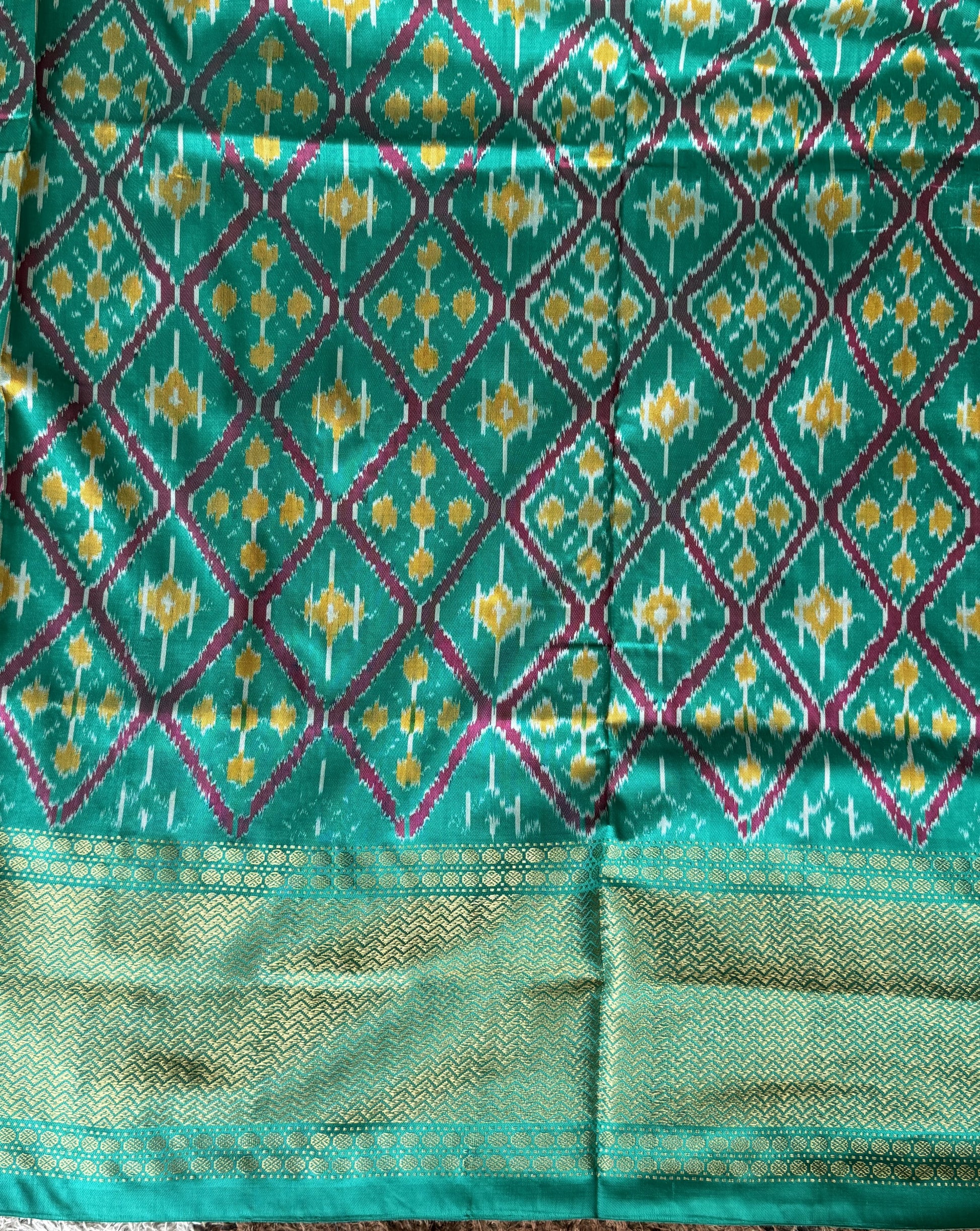 Ikkat Pattu Saree Dark Pink colored complemented with a Kanchi border. - Sampradaya Designer Studio
