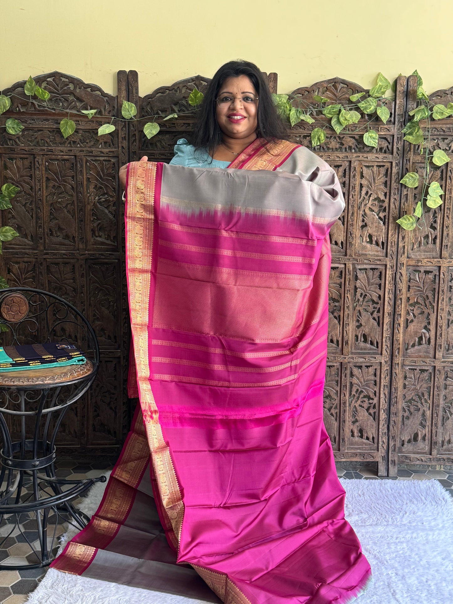 Pure Kanjivaram Silk Saree Light Gray Colored Elegantly Paid with a Gold Zari Border.