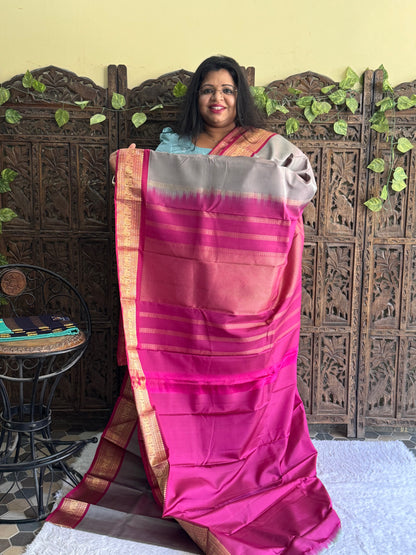 Pure Kanjivaram Silk Saree Light Gray Colored Elegantly Paid with a Gold Zari Border.