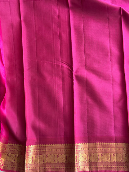 Pure Kanjivaram Silk Saree Light Gray Colored Elegantly Paid with a Gold Zari Border.