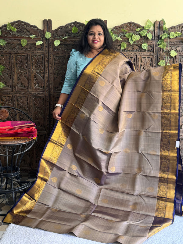 Pure Kanjivaram Silk Saree Seal Gray Colored Elegantly Paid with a Gold Zari Border. - Sampradaya Designer Studio