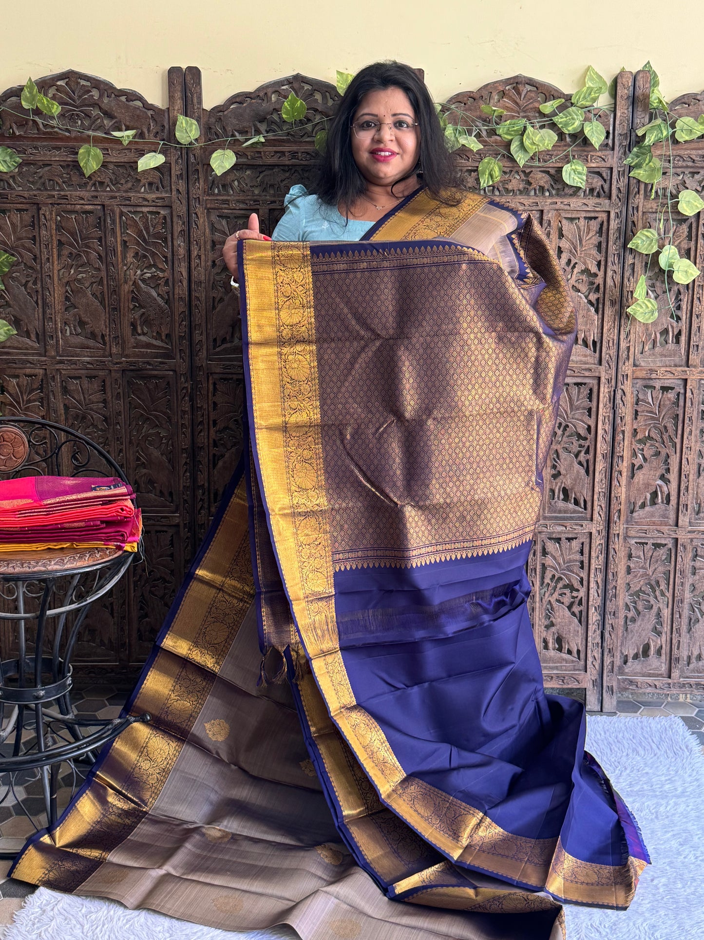 Pure Kanjivaram Silk Saree Seal Gray Colored Elegantly Paid with a Gold Zari Border.