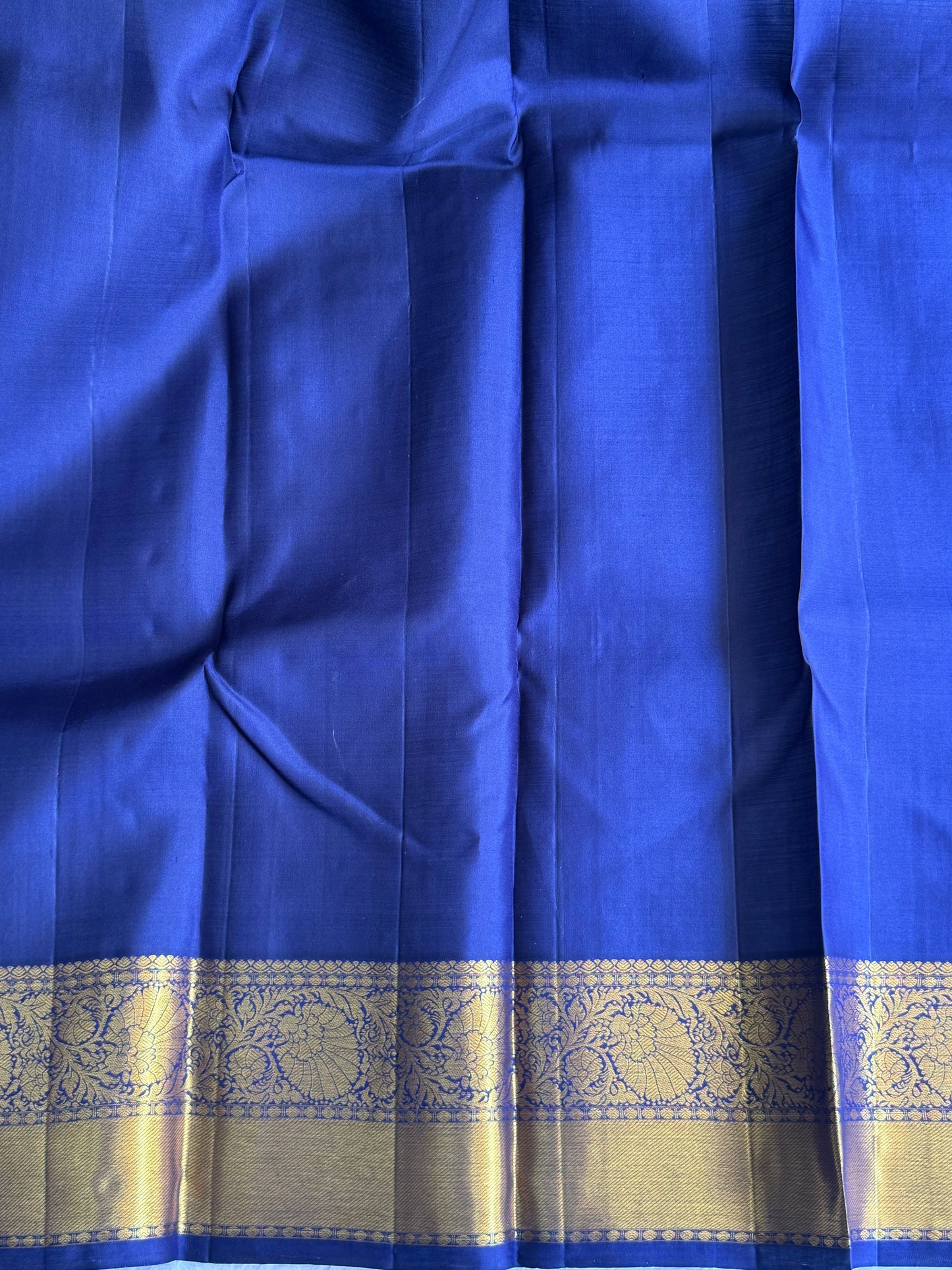Pure Kanjivaram Silk Saree Seal Gray Colored Elegantly Paid with a Gold Zari Border.