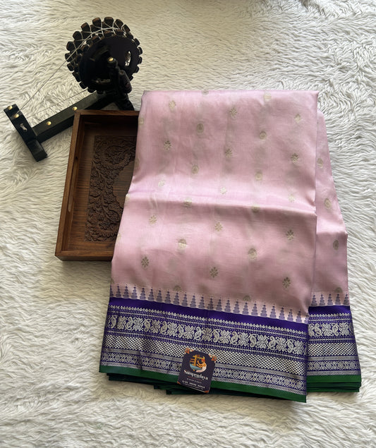 Gadwal Silk Saree Light Pink Colored complemented with a Violet Color Zari Border. - Sampradaya Designer Studio