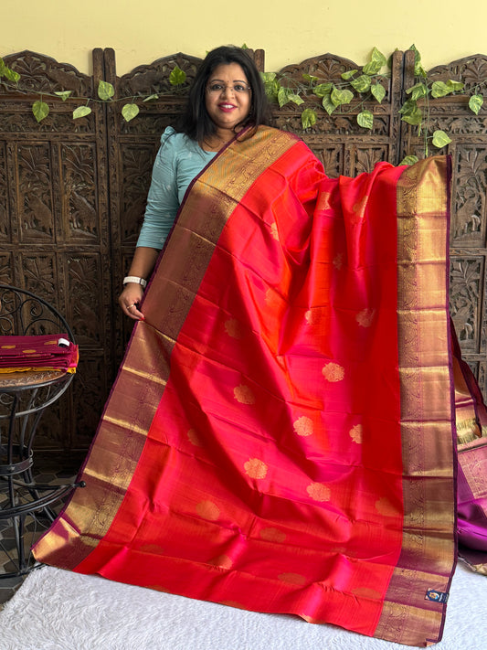 Pure Kanjivaram Silk Saree Cerise Colored Elegantly Paid with a Gold Zari Border.
