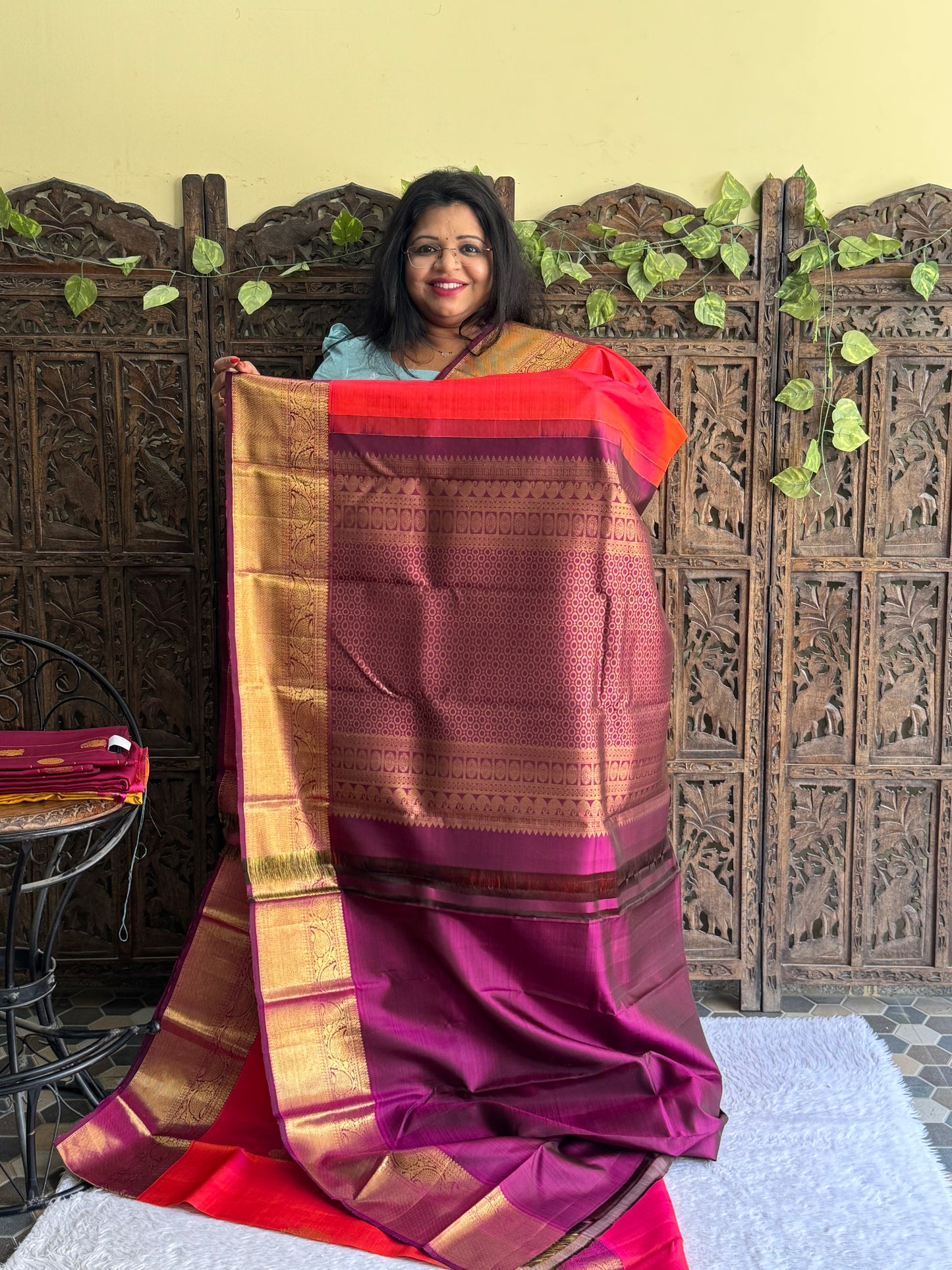 Pure Kanjivaram Silk Saree Cerise Colored Elegantly Paid with a Gold Zari Border.