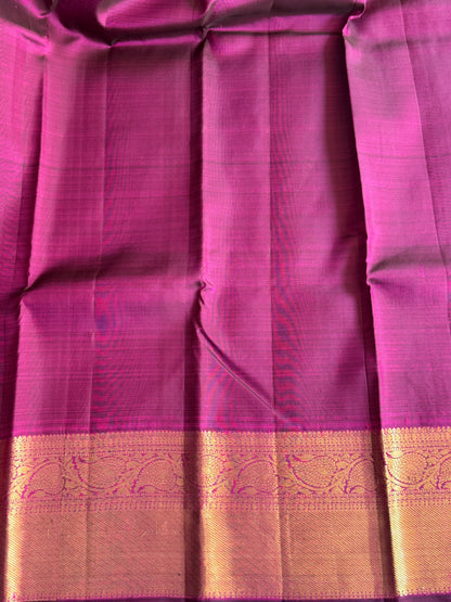 Pure Kanjivaram Silk Saree Cerise Colored Elegantly Paid with a Gold Zari Border.