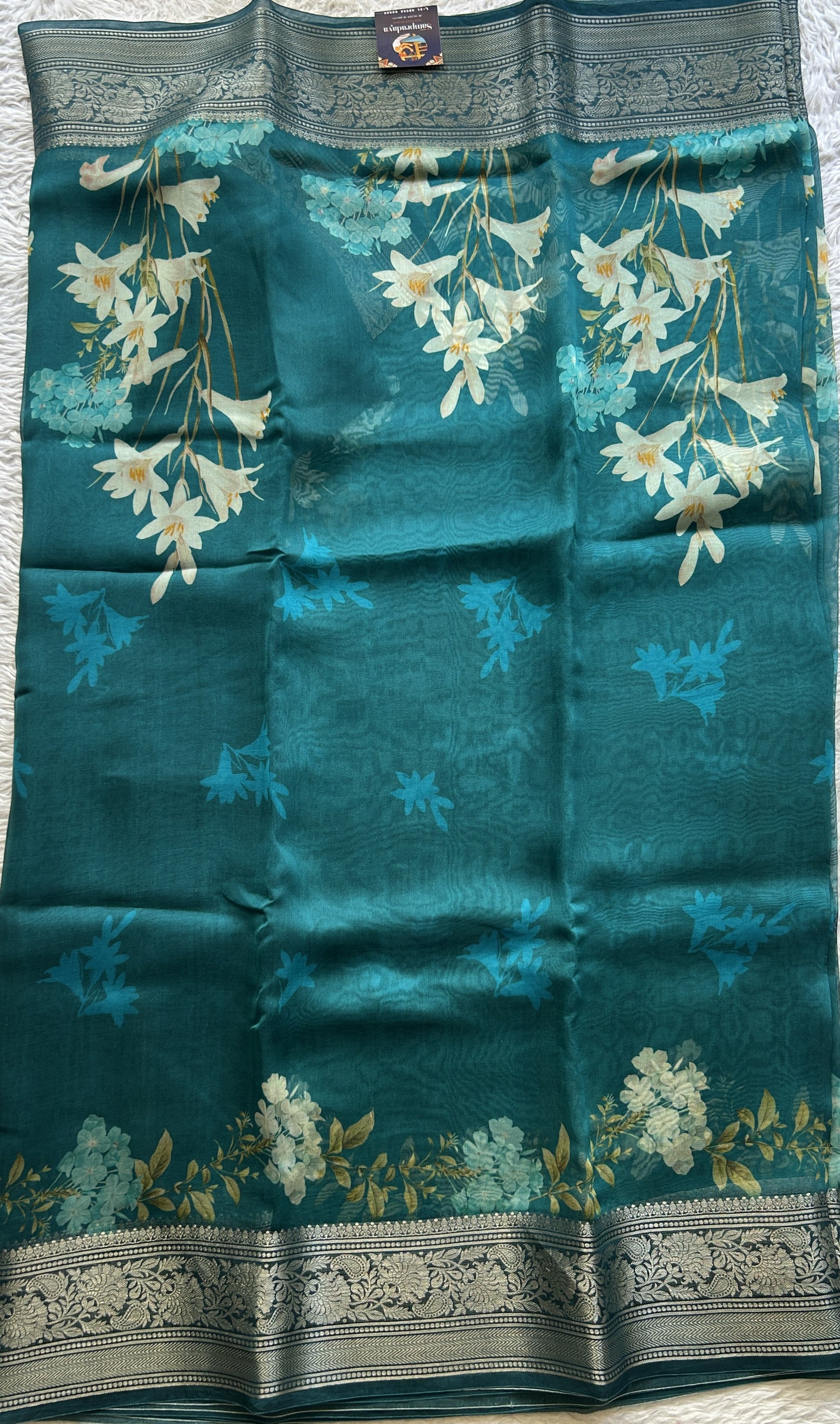 Soft Organza Designer Saree Teal Blue colored Saree Paired with a Zari border. - Sampradaya Designer Studio
