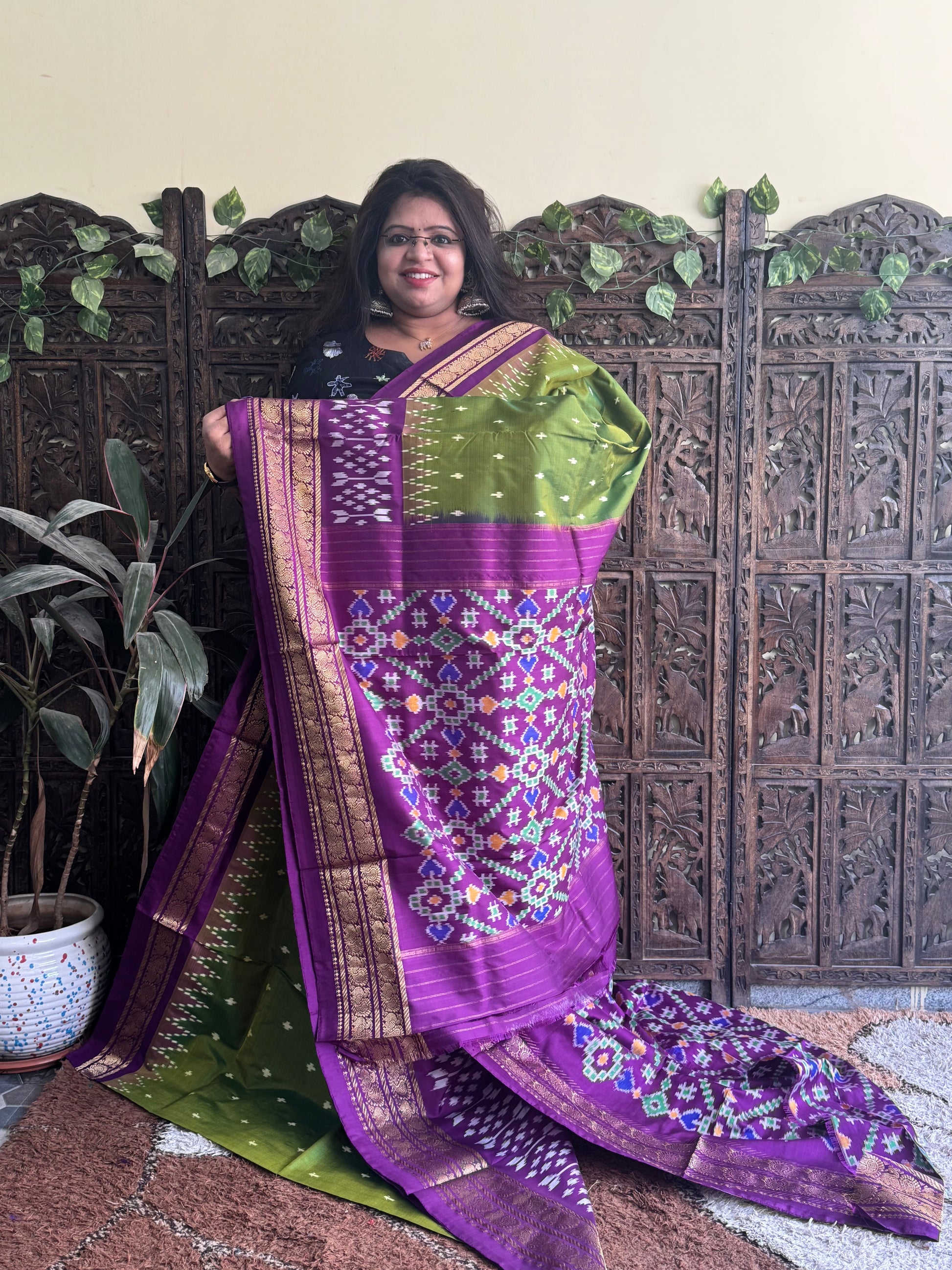 Ikkat Pattu Saree Olive Green colored complemented with a Purple Kanchi border. - Sampradaya Designer Studio