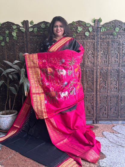 Ikkat Pattu Saree Black colored complemented with a Pink Kanchi border. - Sampradaya Designer Studio