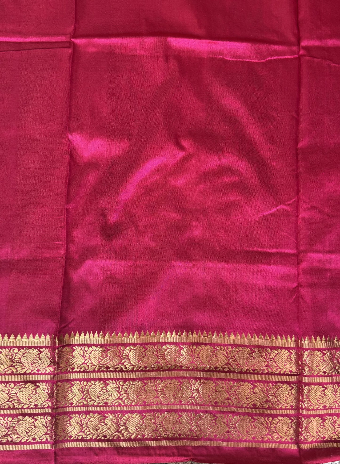 Ikkat Pattu Saree Black colored complemented with a Pink Kanchi border. - Sampradaya Designer Studio
