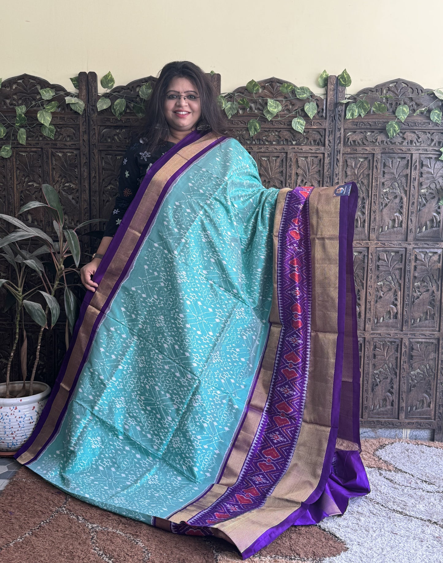Ikkat Pattu Saree Sea Green colored complemented with a Violet Kanchi border. - Sampradaya Designer Studio