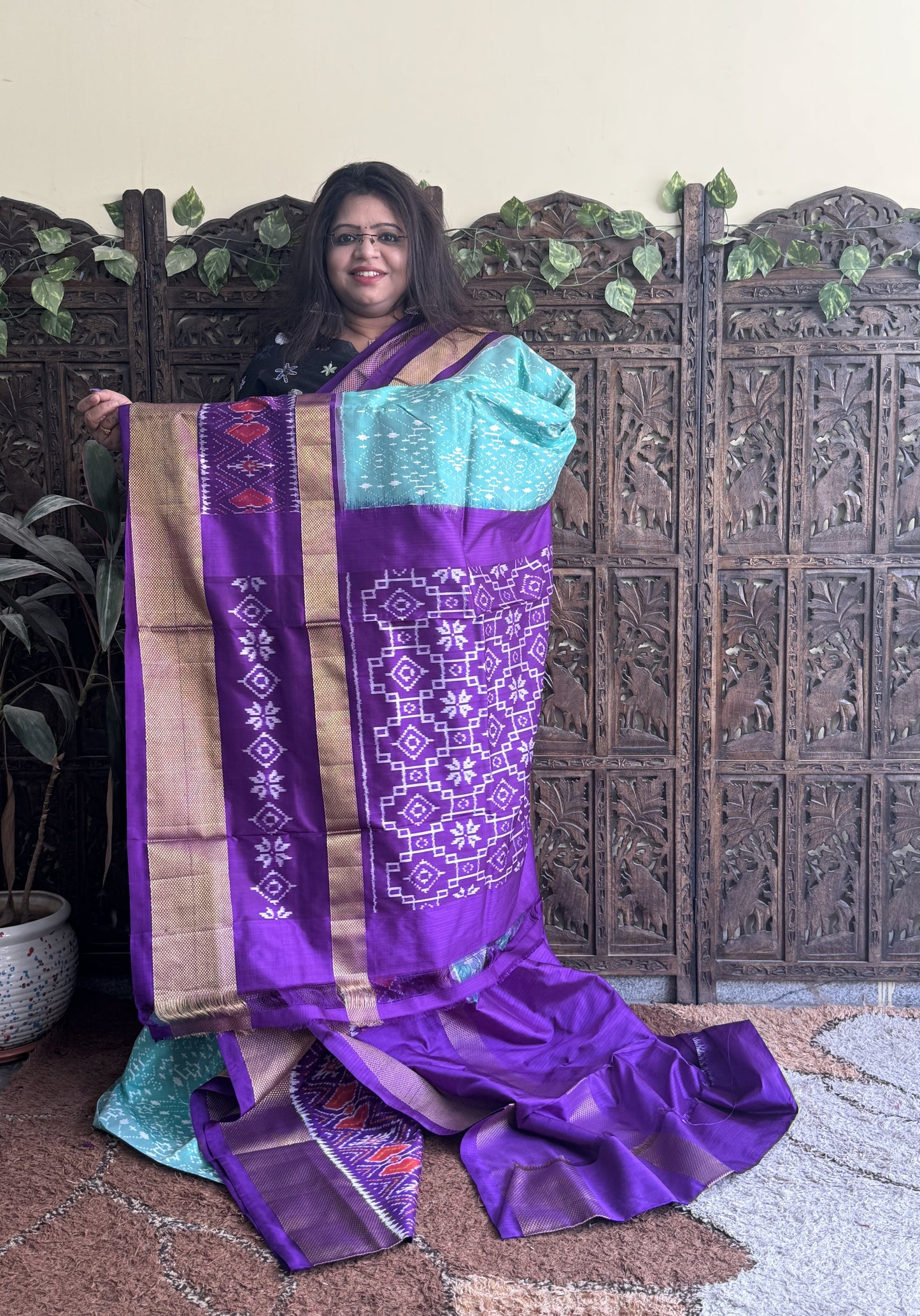 Ikkat Pattu Saree Sea Green colored complemented with a Violet Kanchi border. - Sampradaya Designer Studio