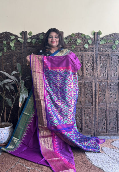 Ikkat Pattu Saree Purple colored complemented with a Violet Kanchi border. - Sampradaya Designer Studio