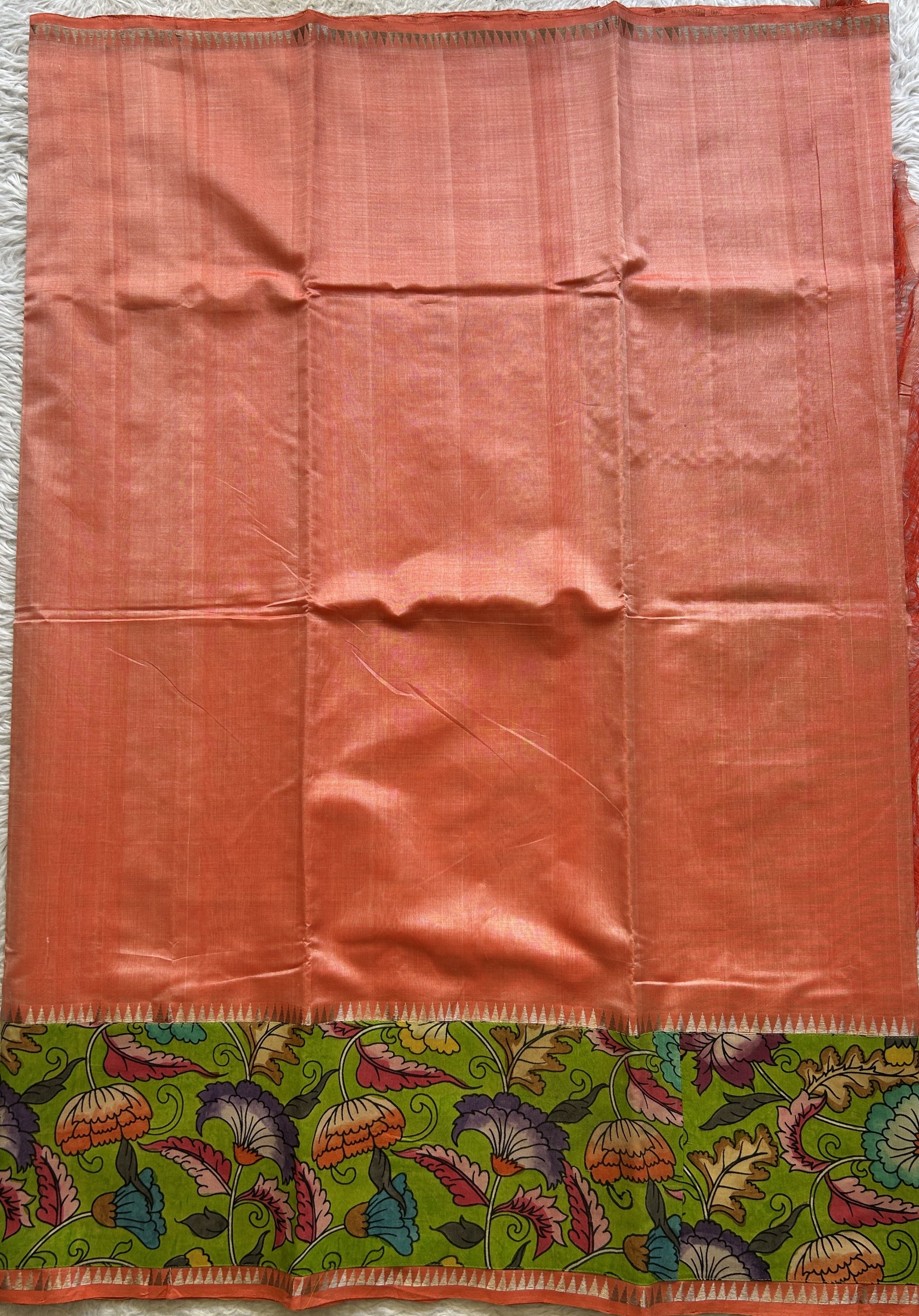 Mangalagiri Plain Pattu Saree Orange colored complemented with a Pen Kalamkari Border. - Sampradaya Designer Studio