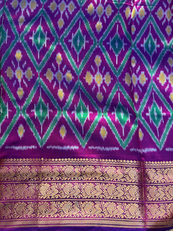 Ikkat Pattu Saree Purple colored complemented with a Violet Kanchi border. - Sampradaya Designer Studio