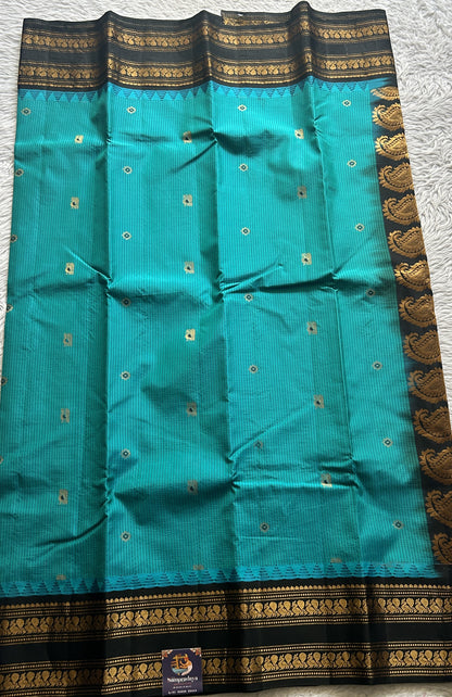 Gadwal Silk Saree Turquoise Blue Colored complemented with a Black Color Zari Border. - Sampradaya Designer Studio
