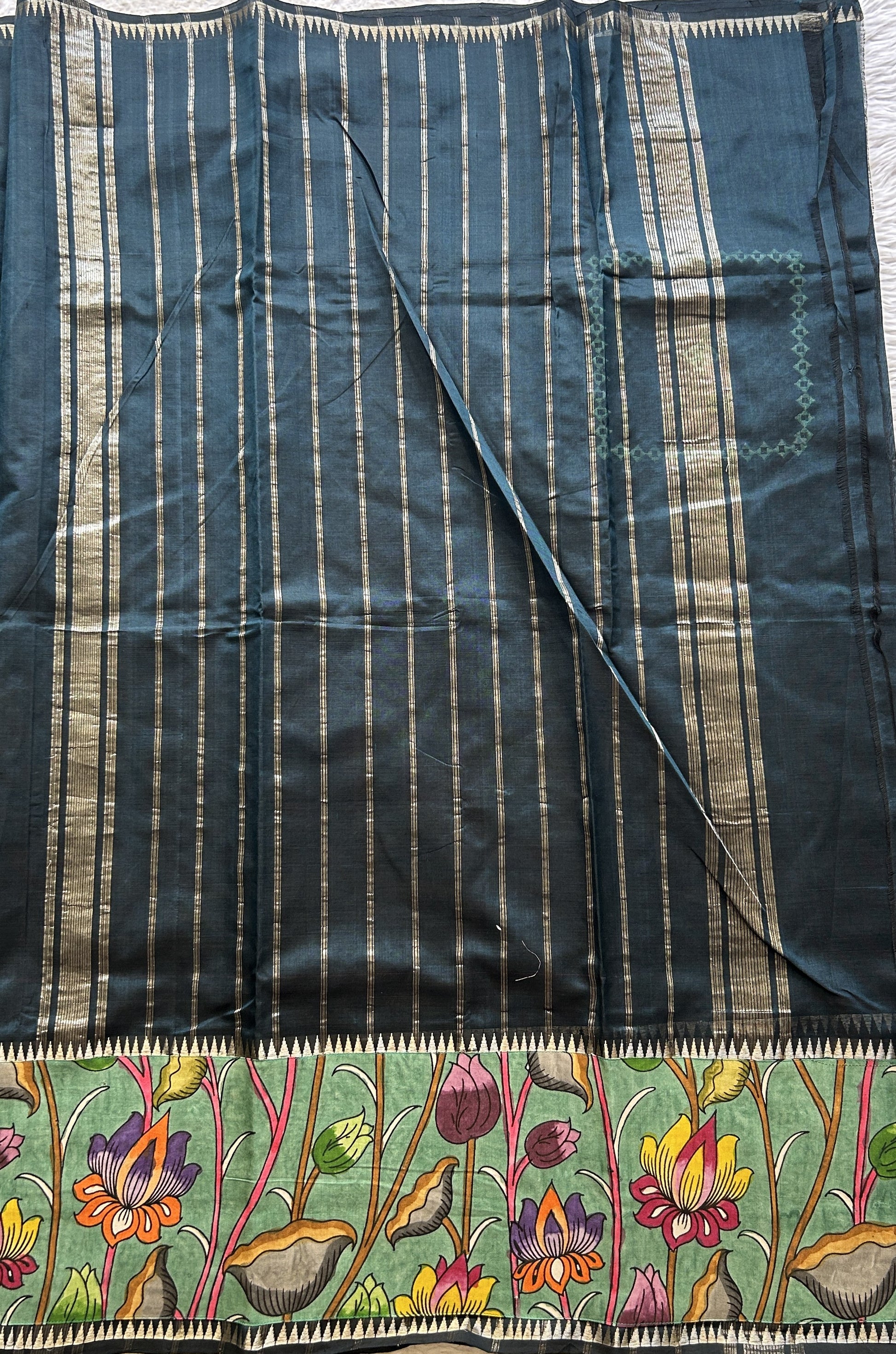 Mangalagiri Plain Pattu Saree Bottle Green colored complemented with a Pen Kalamkari Border. - Sampradaya Designer Studio