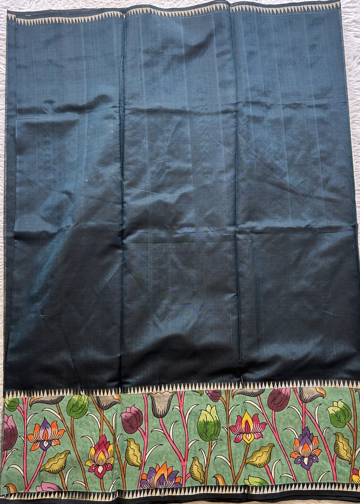 Mangalagiri Plain Pattu Saree Bottle Green colored complemented with a Pen Kalamkari Border. - Sampradaya Designer Studio