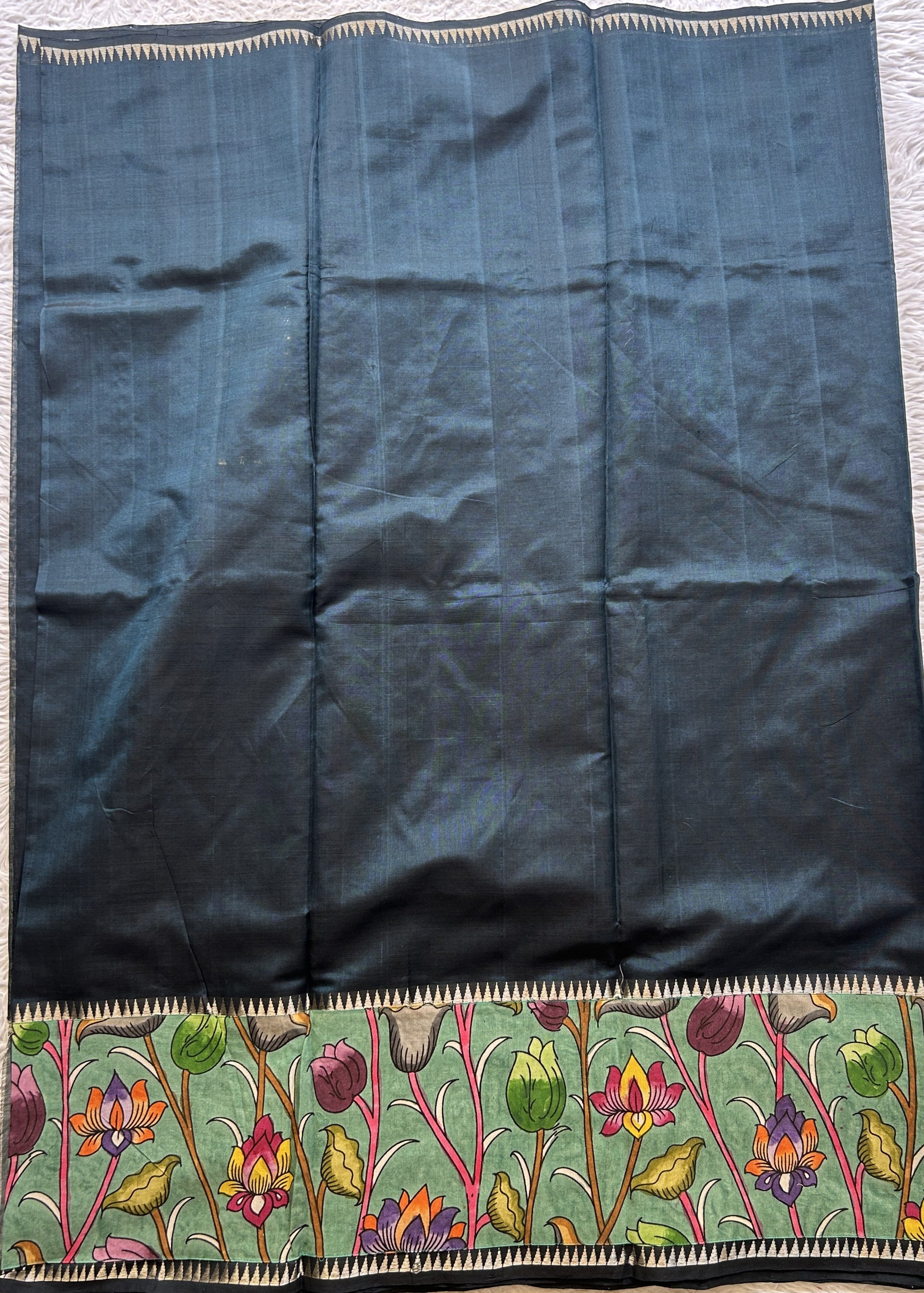 Mangalagiri Plain Pattu Saree Bottle Green colored complemented with a Pen Kalamkari Border. - Sampradaya Designer Studio