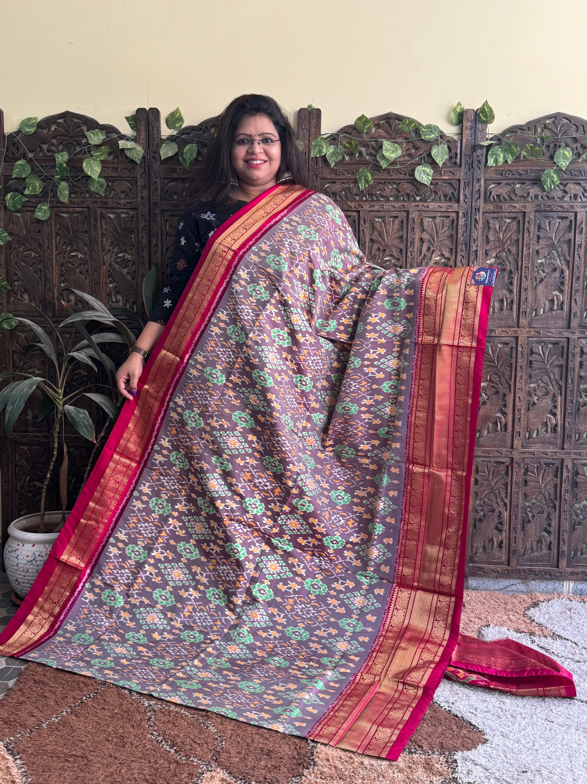Ikkat Pattu Saree Gray colored complemented with a Dark PinkKanchi border. - Sampradaya Designer Studio