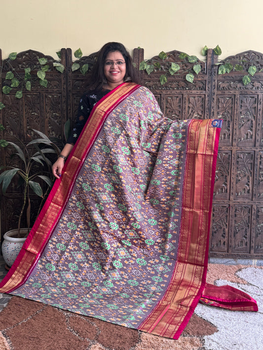 Ikkat Pattu Saree Gray colored complemented with a Dark PinkKanchi border. - Sampradaya Designer Studio