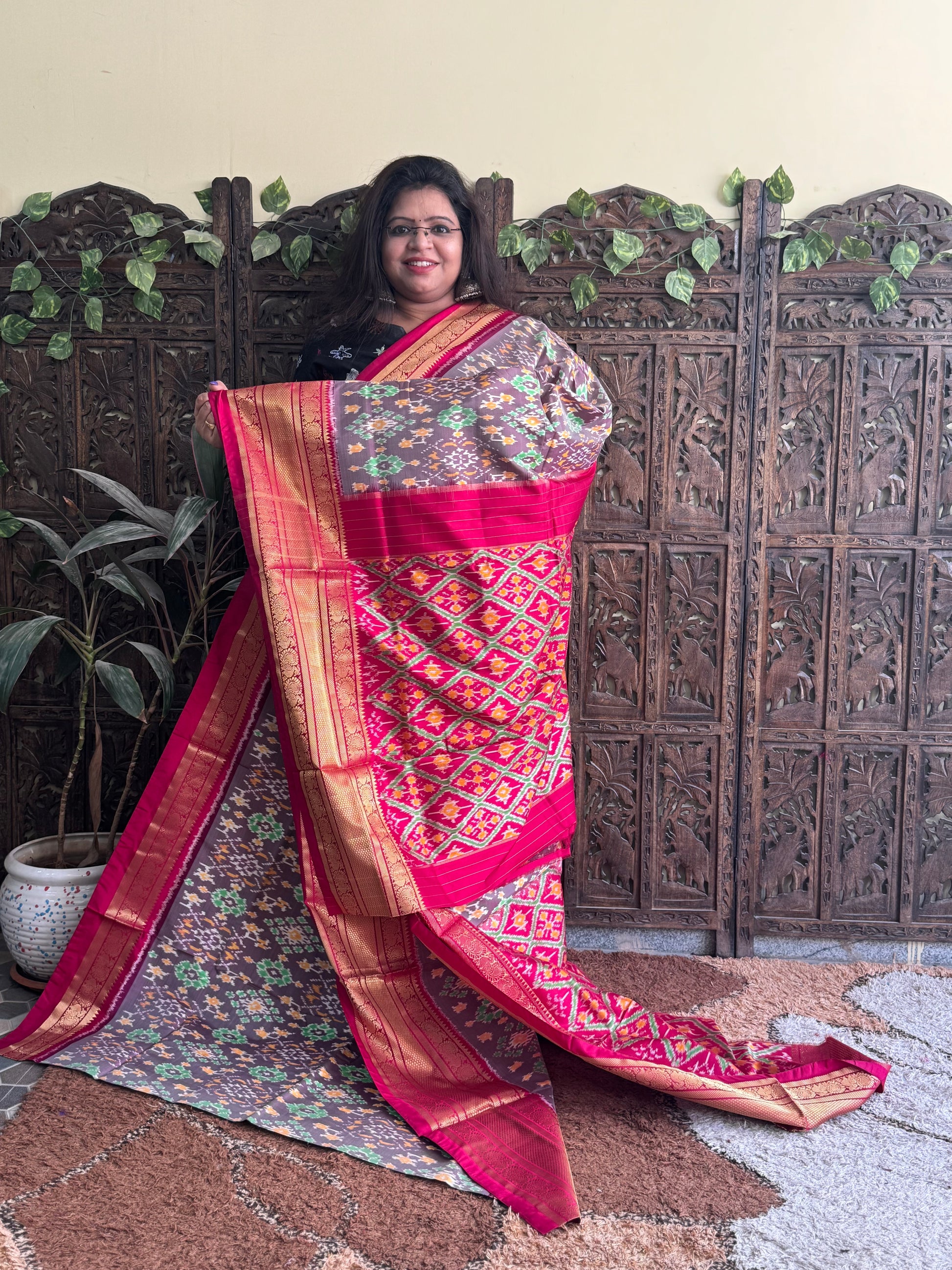 Ikkat Pattu Saree Gray colored complemented with a Dark PinkKanchi border. - Sampradaya Designer Studio