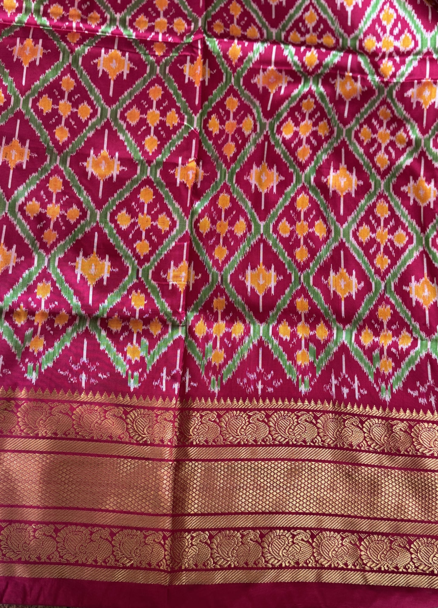 Ikkat Pattu Saree Gray colored complemented with a Dark PinkKanchi border. - Sampradaya Designer Studio
