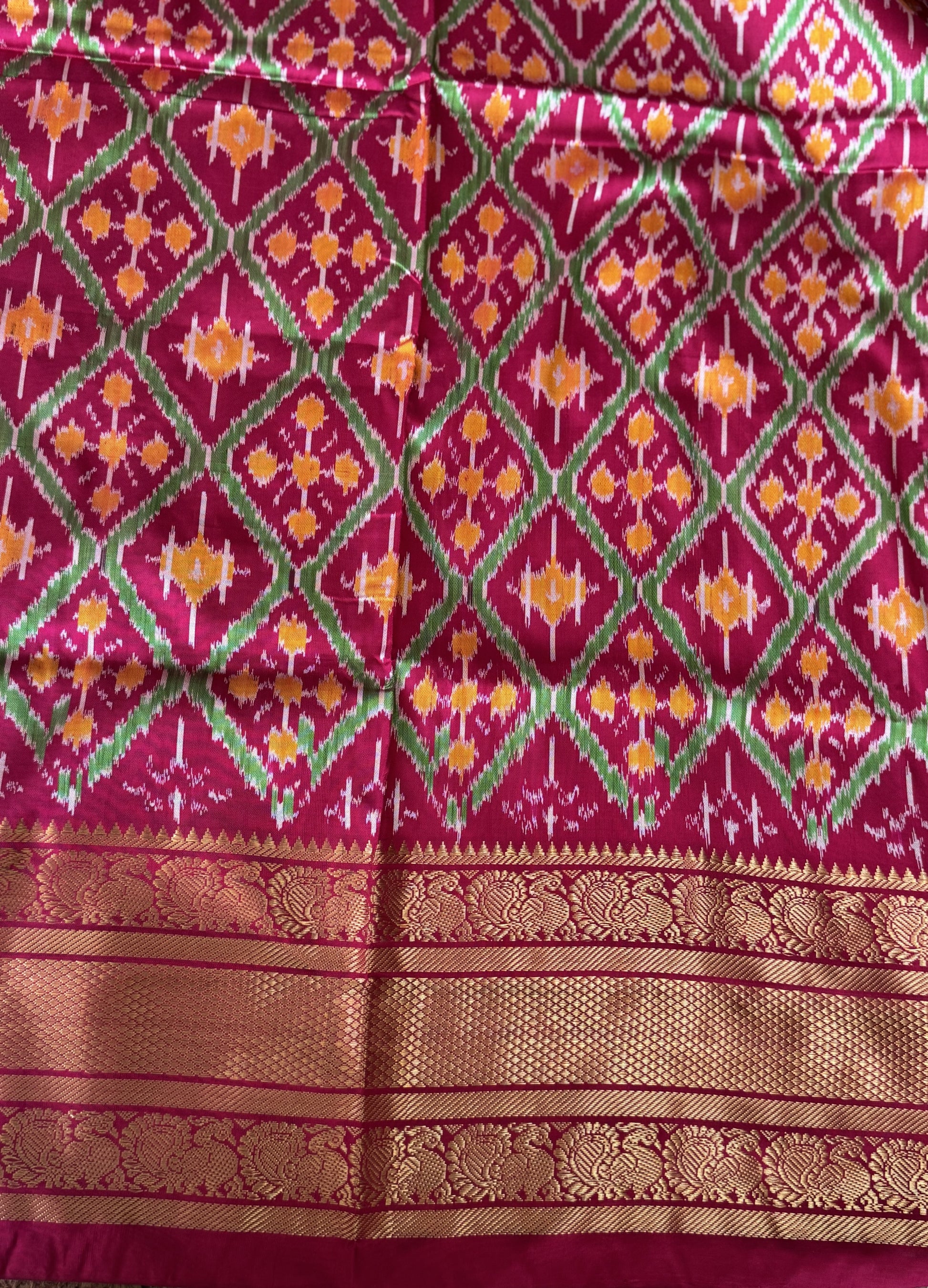 Ikkat Pattu Saree Gray colored complemented with a Dark PinkKanchi border. - Sampradaya Designer Studio