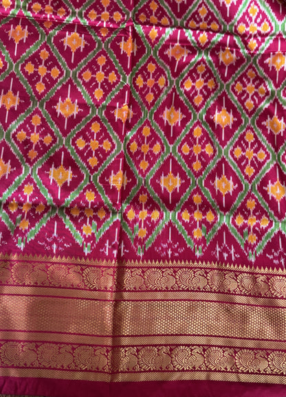 Ikkat Pattu Saree Gray colored complemented with a Dark PinkKanchi border. - Sampradaya Designer Studio