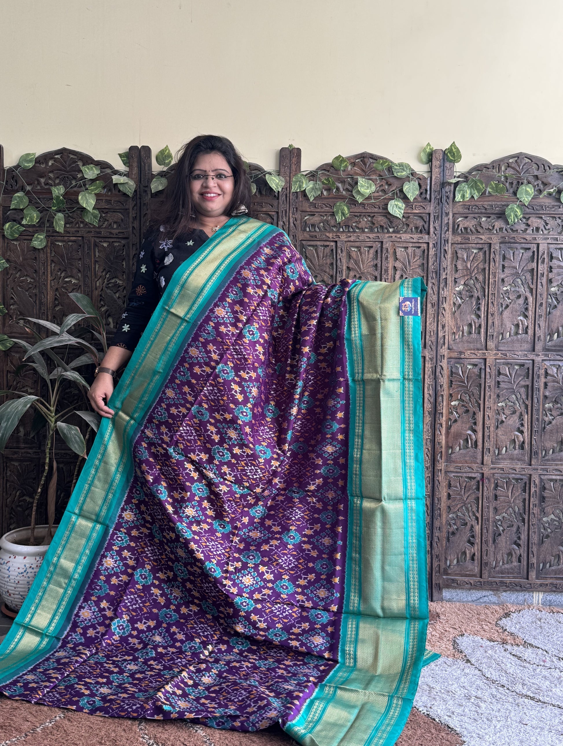 Ikkat Pattu Saree Purple colored complemented with a Sea Green Kanchi border. - Sampradaya Designer Studio