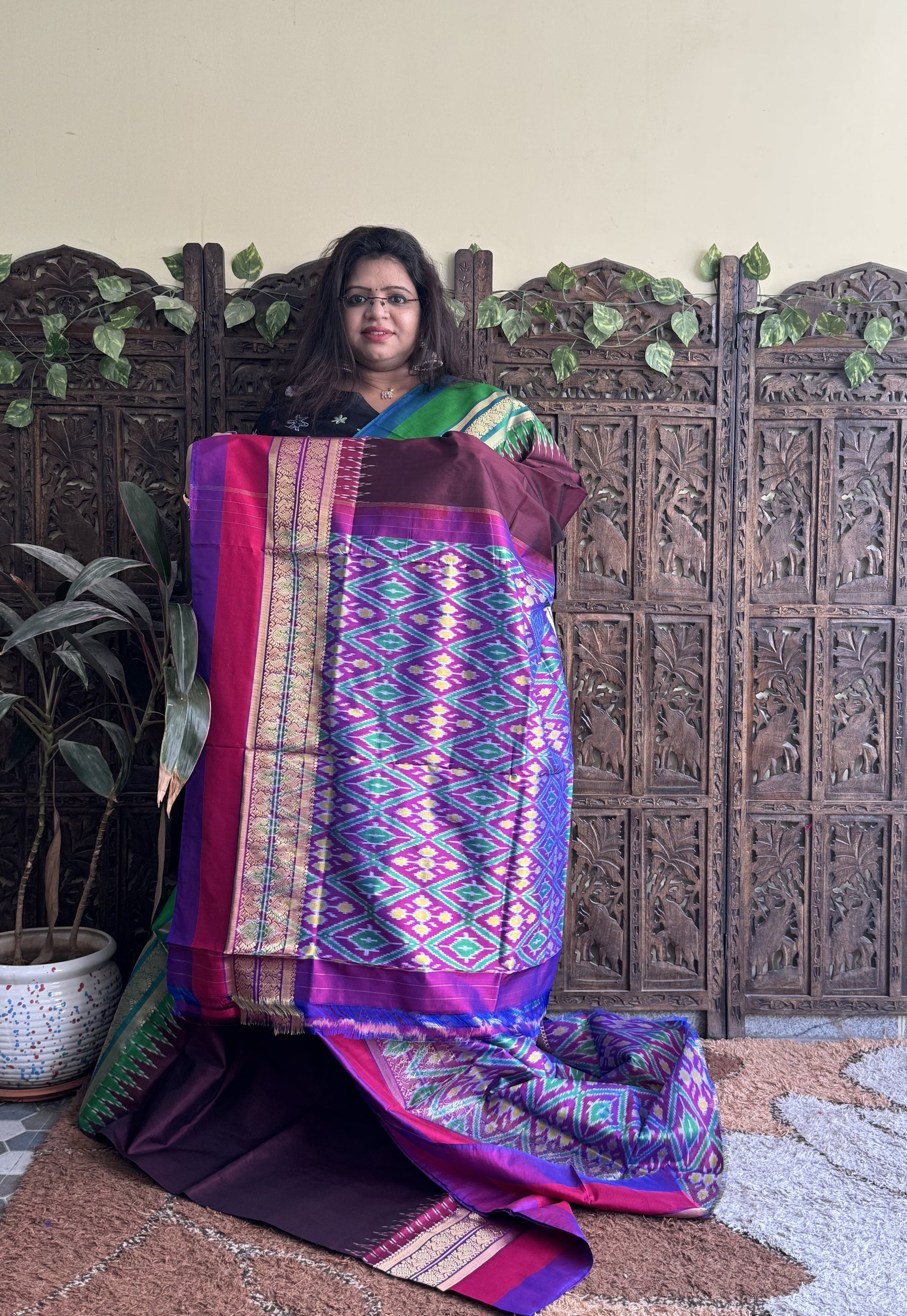 Ikkat Pattu Saree Dark Maroon colored complemented with a Kanchi border. - Sampradaya Designer Studio