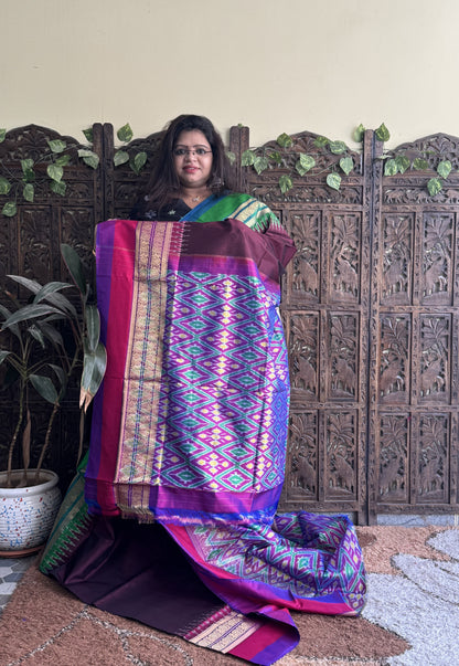 Ikkat Pattu Saree Dark Maroon colored complemented with a Kanchi border. - Sampradaya Designer Studio