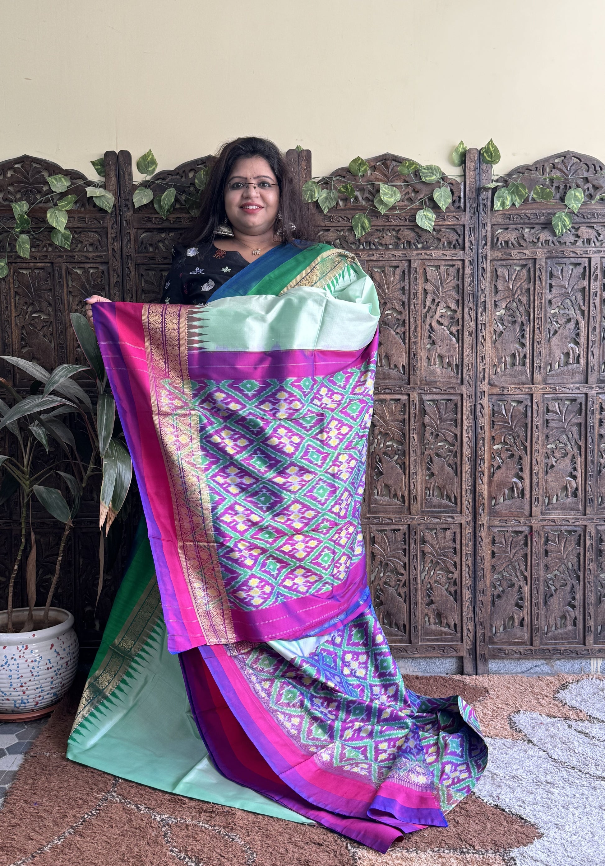 Ikkat Pattu Saree Sea foam colored complemented with a Kanchi border. - Sampradaya Designer Studio