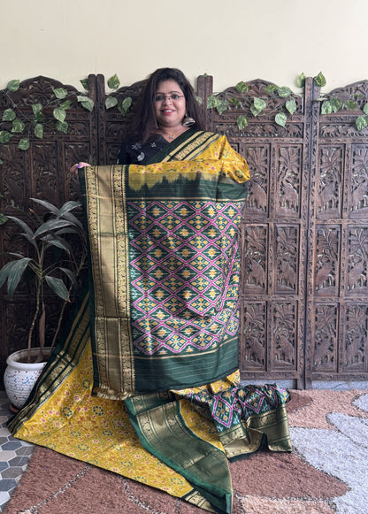 Ikkat Pattu Saree Yellow colored complemented with a Kanchi border. - Sampradaya Designer Studio