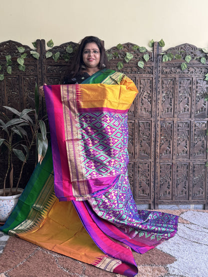 Ikkat Pattu Saree Turmeric Yellow colored complemented with a Kanchi border. - Sampradaya Designer Studio