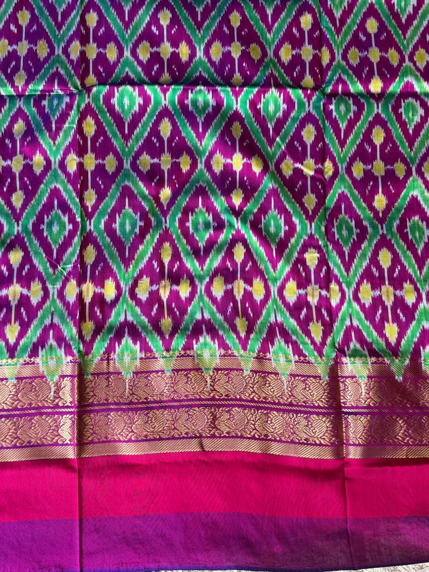 Ikkat Pattu Saree Turmeric Yellow colored complemented with a Kanchi border. - Sampradaya Designer Studio