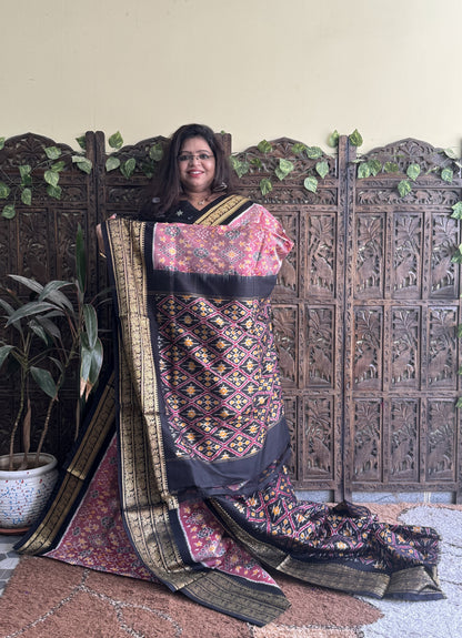 Ikkat Pattu Saree Onion Pink colored complemented with a Kanchi border. - Sampradaya Designer Studio