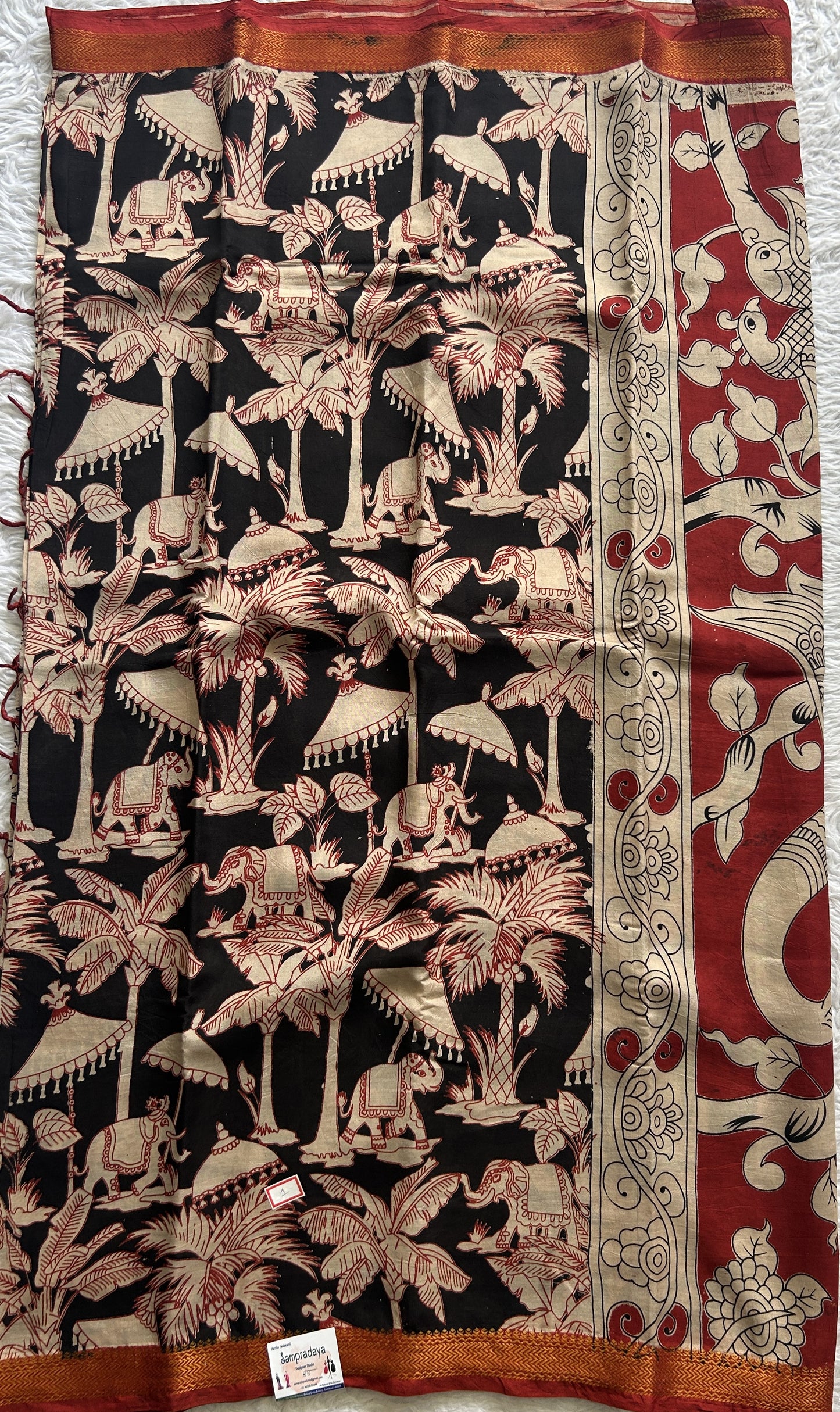 Mangalagiri Pen Kalamkari Saree Black colored complemented with a Zari border - Sampradaya Designer Studio