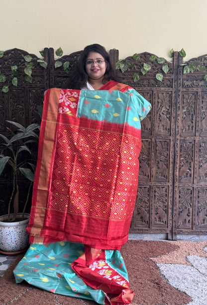 Ikkat Pattu Saree Sea Green colored complemented with a Zari border. - Sampradaya Designer Studio